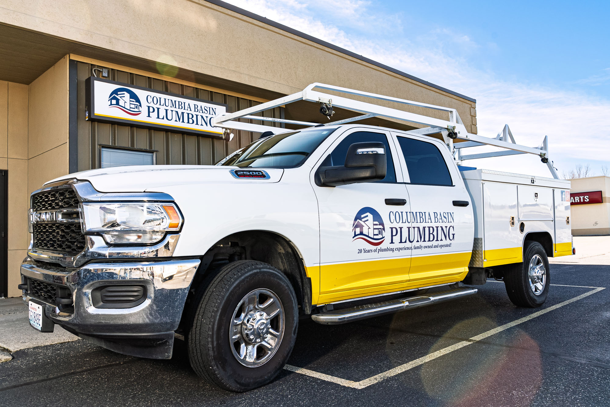 Columbia Basin Plumbing service truck outside building