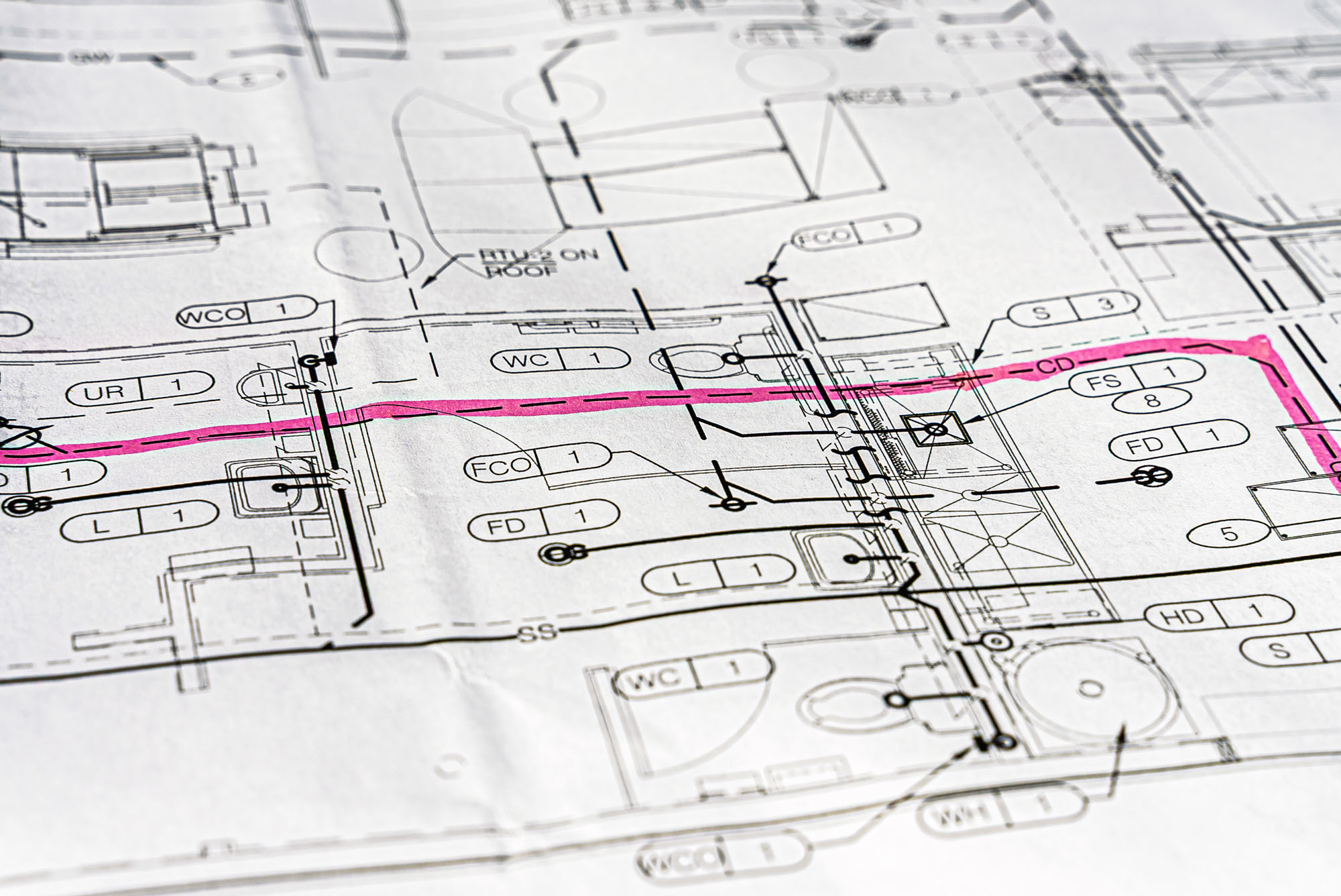Architectural blueprint with highlighted pink path.