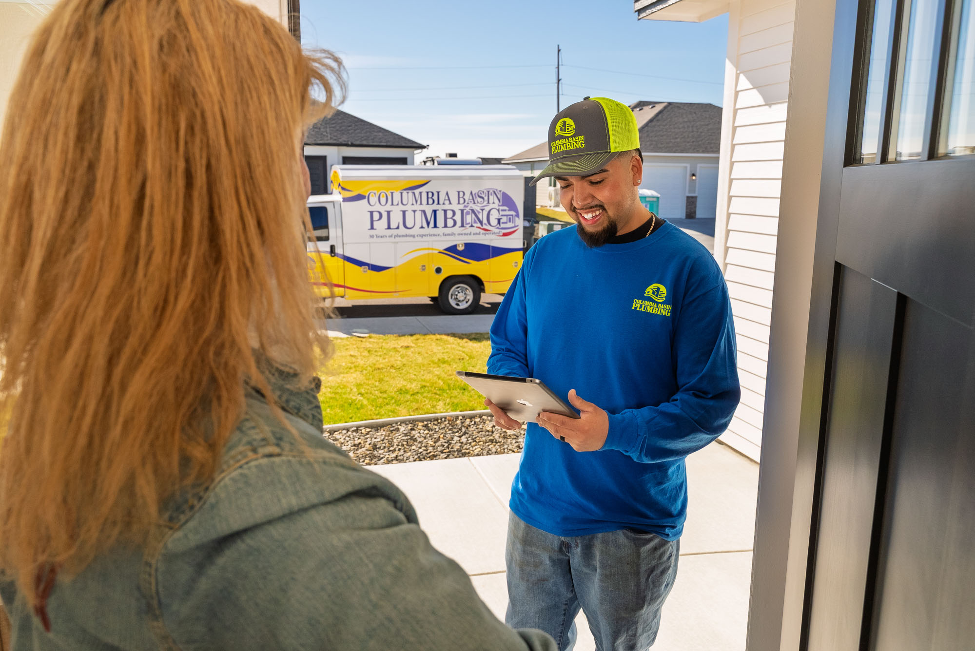 Plumber visiting home for service consultation.