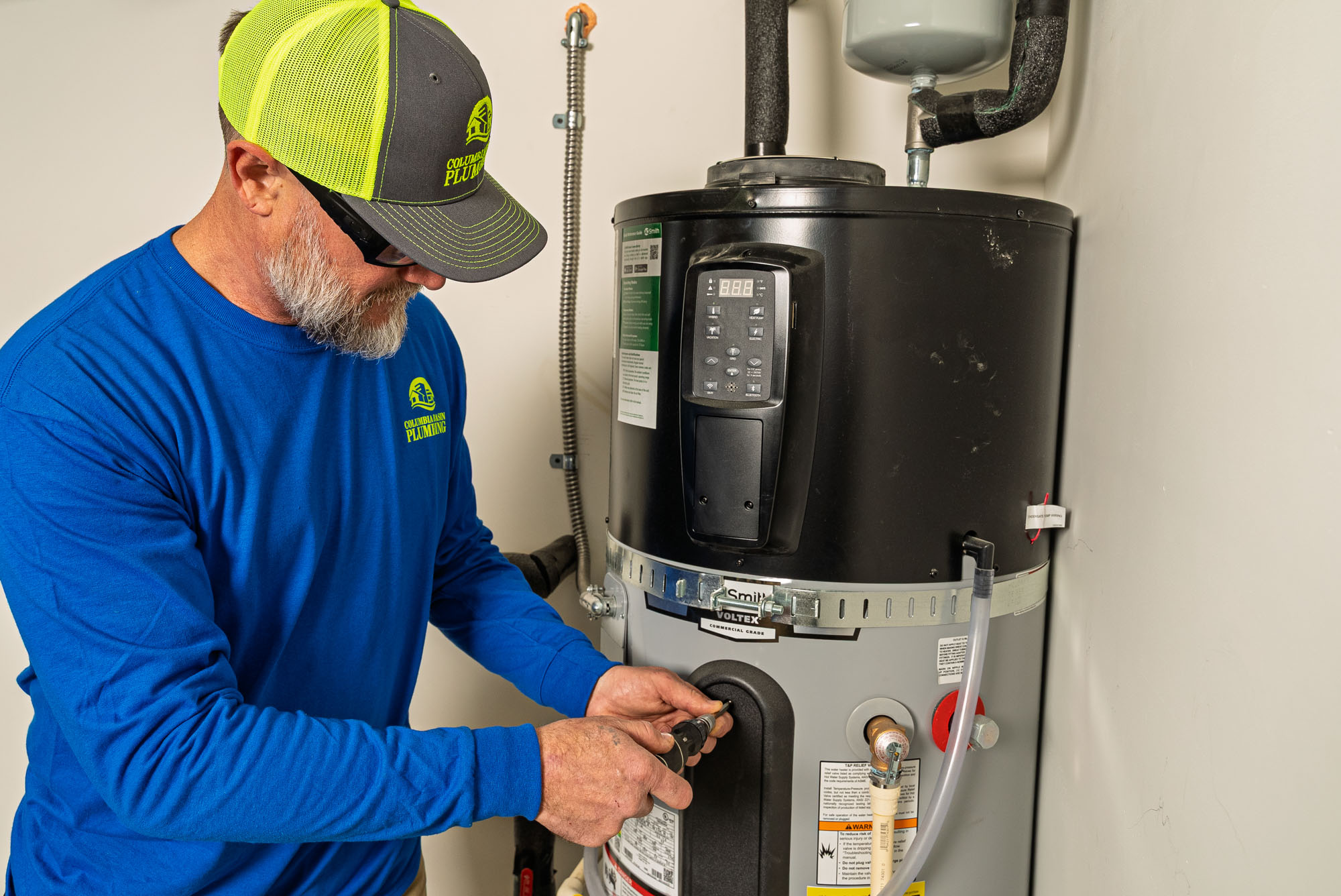 Technician servicing a water heater.