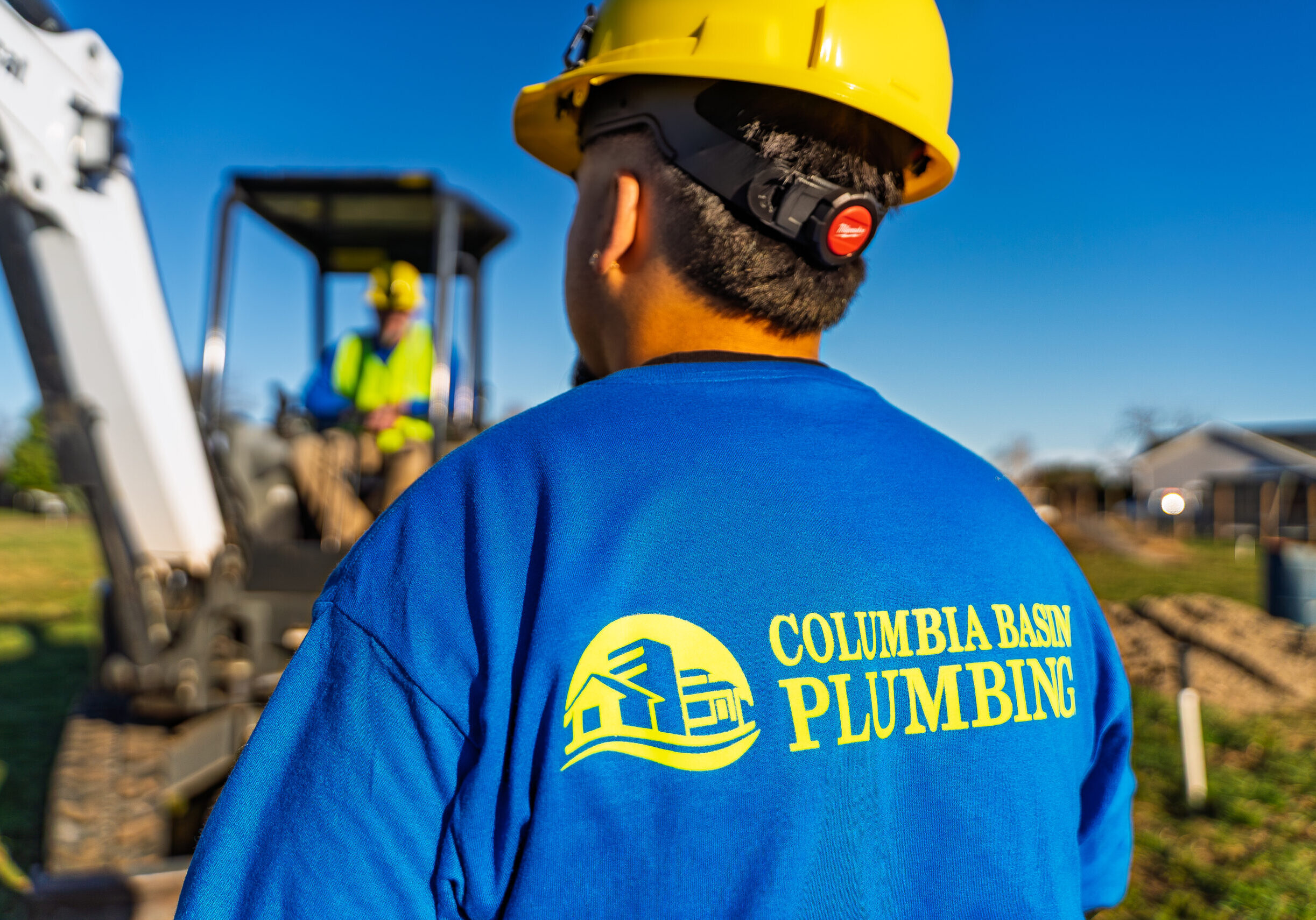 Construction worker with Columbia Basin Plumbing shirt